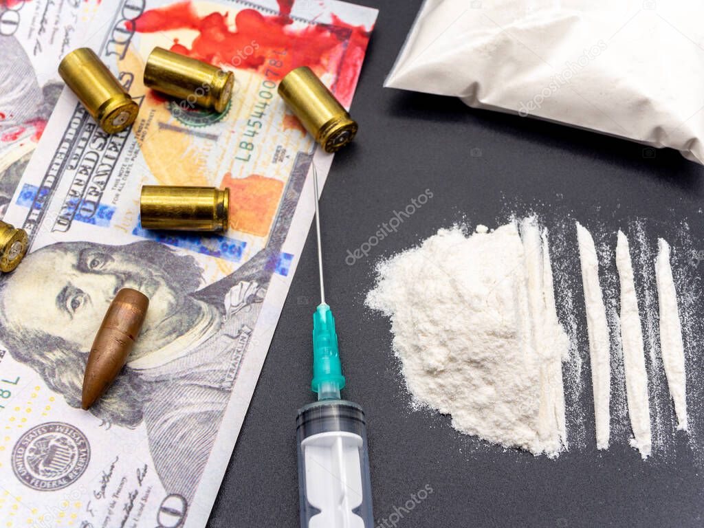 syringe hundred dollars bills cocaine heroine and pistol cartridges drug addiction social issues concept