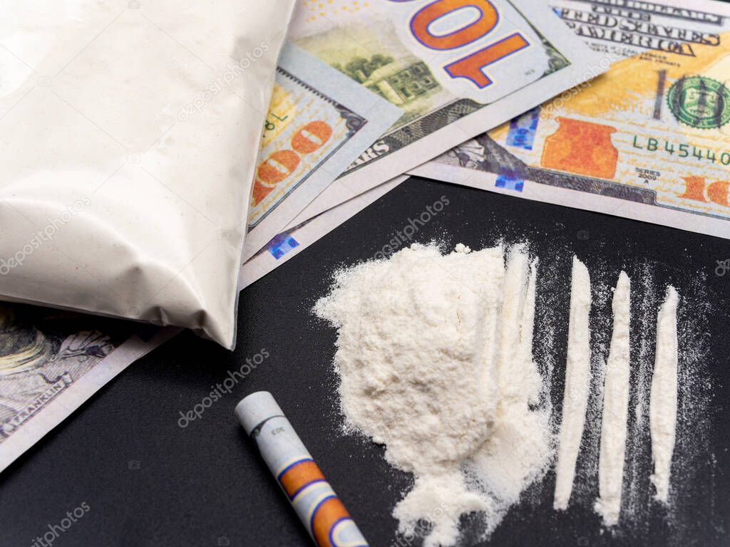 hundred dollars bills cocaine heroine drug addiction social issues concept