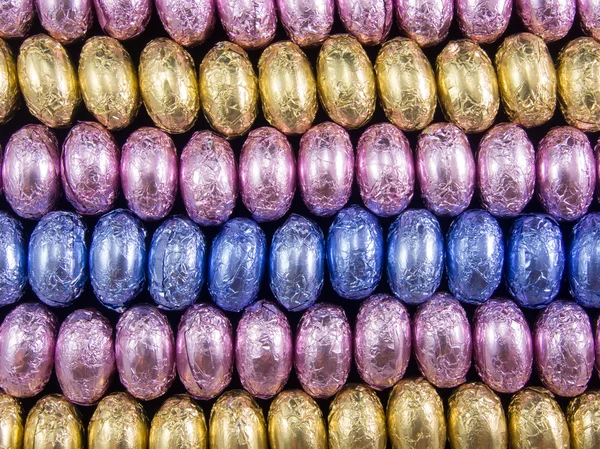 Multicolor choco eggs rows — Stock Photo, Image