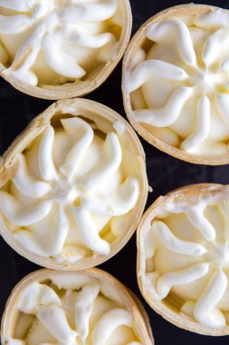 delicious assorted waffle ice cream with vanilla and chocolate on black