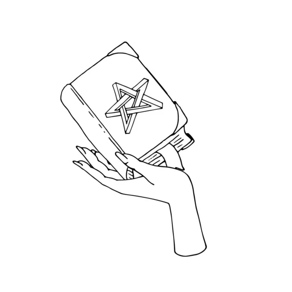 Libro de hechizos místicos vintage con estrella imposible en la cubierta en la mano femenina — Vector de stock