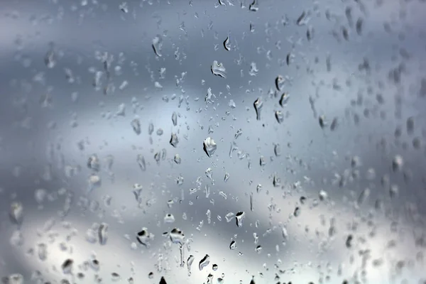 Rain Drops On Window Glass in Summer Day - is a beauty, background, texture picture of rain drops on window glass!