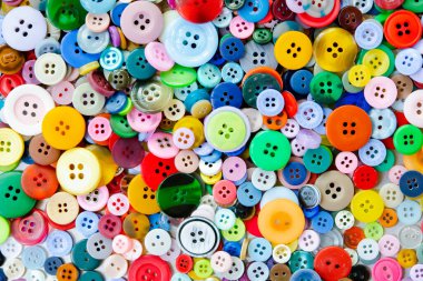 Renkli karışık dikiş düğmeleri arkaplanı. Üst görünüm