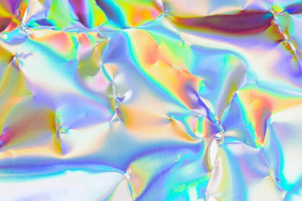 Holographic iridescent background. holographic foil texture background.