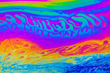 Gökkuşağı renkleri. Psikedelik çok renkli desenler arka planı. Sabun köpüklerinin makro fotoğraf çekimi