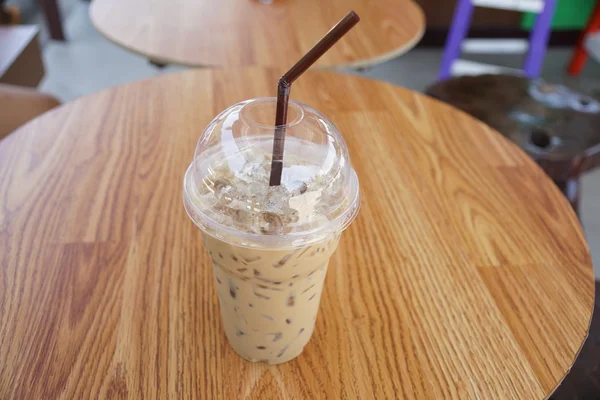 Iced coffee or coffee latte in take away plastic cup — Stock Photo, Image