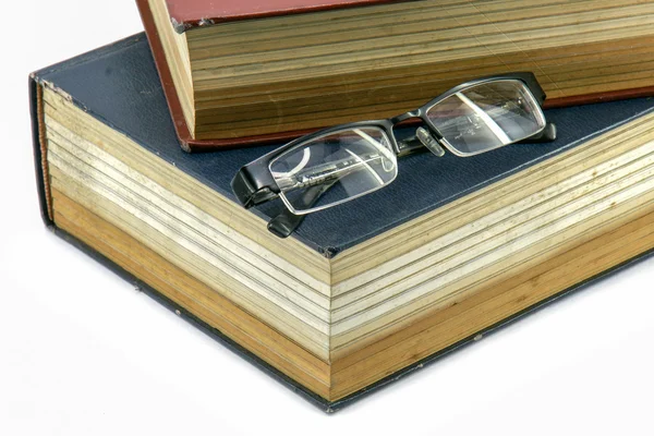 Old text books or bible with eyeglasses on them — Stock Photo, Image