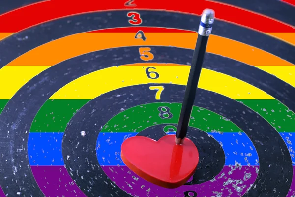 Red heart target and the LGBT gay pride flag — Stock Photo, Image