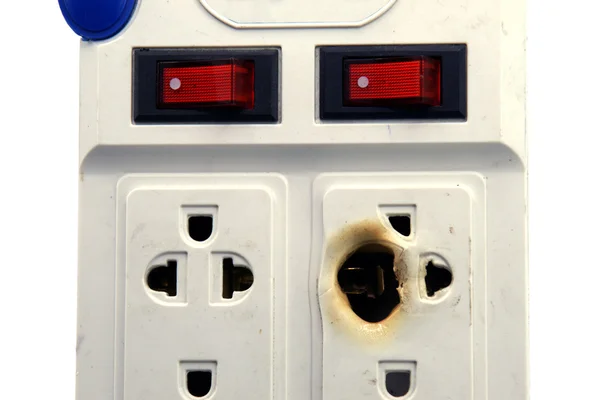 Dirty melted and burned electric outlet plug on white background