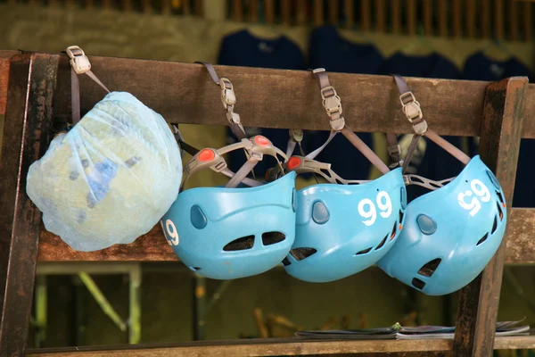 Group of safety helmets for zipline jungle adventure extreme spo — Stock Photo, Image