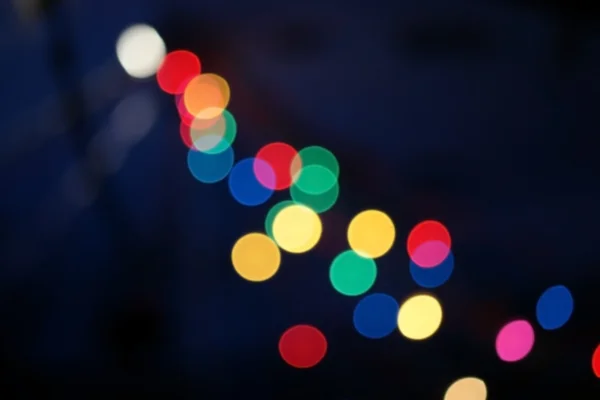 Kleurrijke christmas lights bokeh achtergrond wazig — Stockfoto