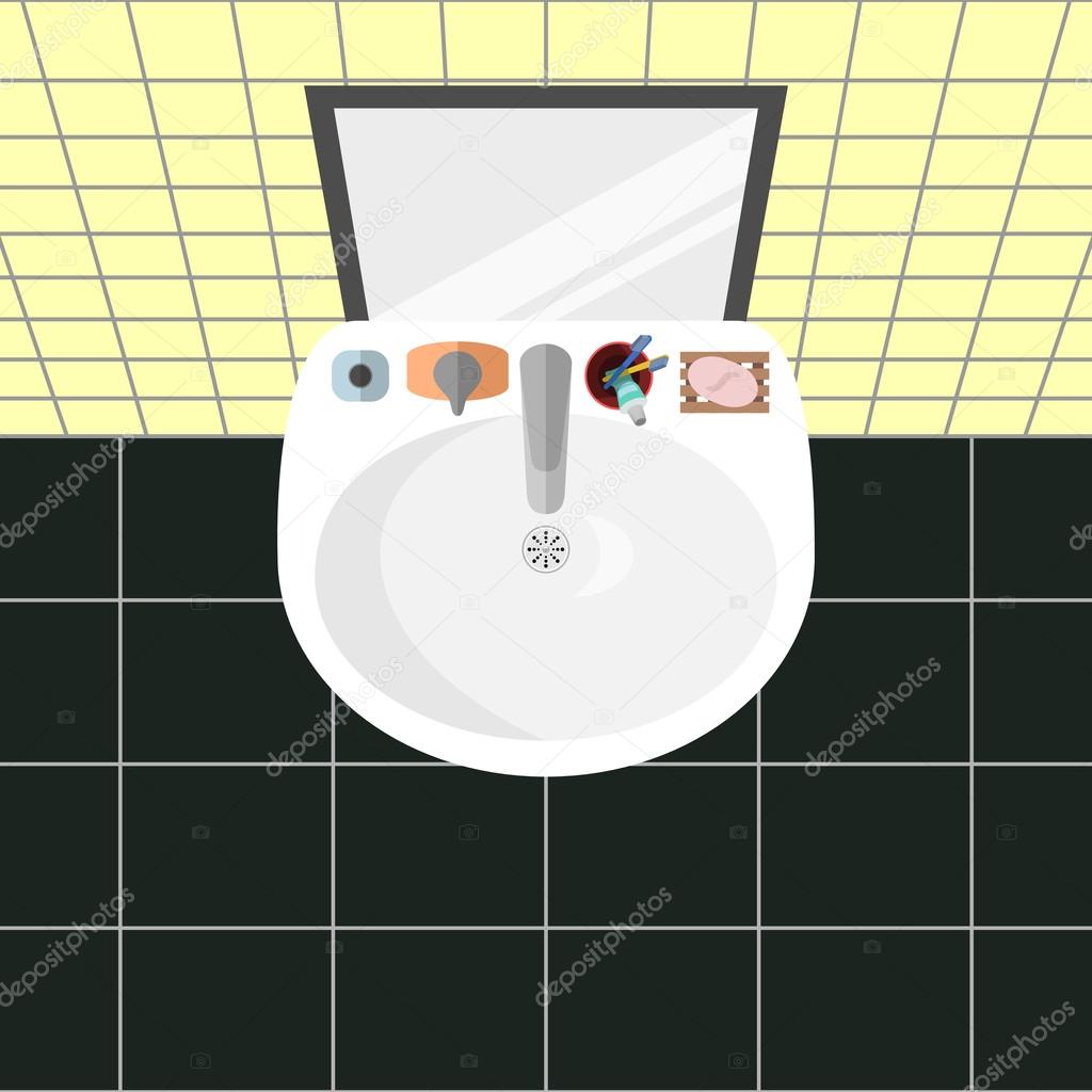 Top view on a sink in a bathroom with a mirror and the main bath accessories