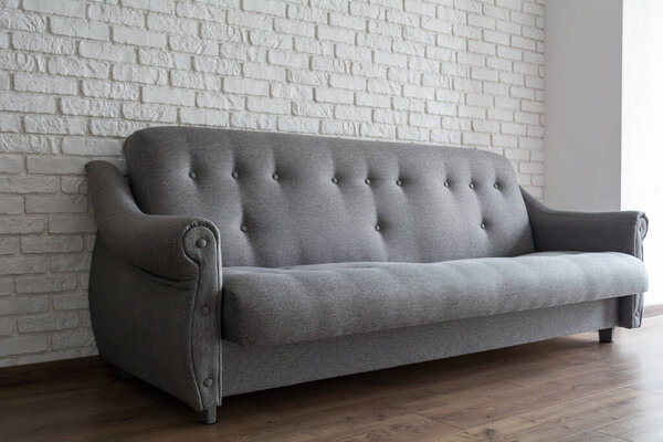 Gray sofa in the room. Modern interior.