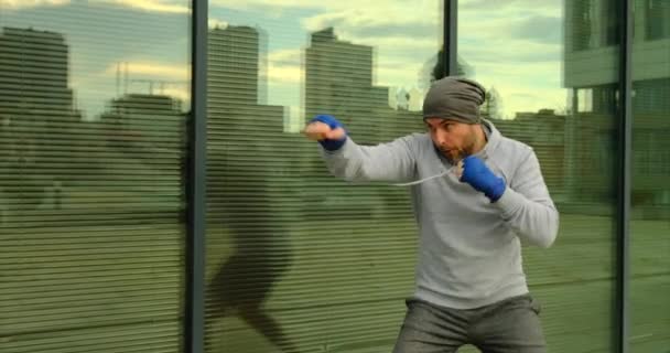 Professional boxer is training on the arena.boxer training outdoors — Stock Video