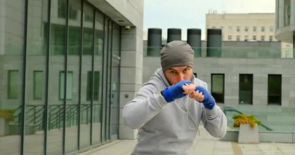Professional boxer is training on the arena.boxer training outdoors — Stock Video