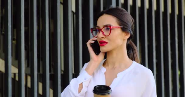 Beautiful Girl with a Phone is Waiting for Her Boyfriend on a Date. Red Lips — Stock Video