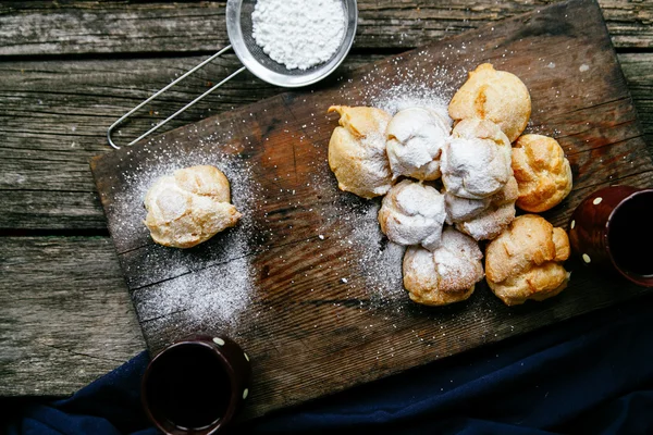 Profiteroles and coffee — Stock Photo, Image