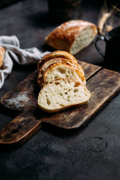 Homemade Ciabatta Bread. Sliced bread slices on a wooden board. Bread 