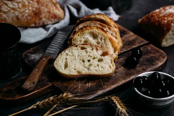 Homemade Ciabatta Bread. Sliced bread slices on a wooden board. Bread
