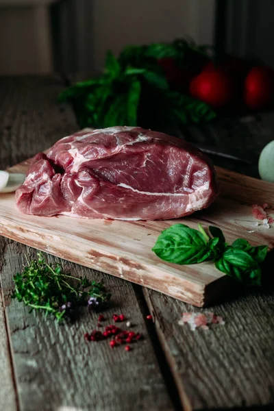 Pork pulp.raw piece of meat on a wooden board.