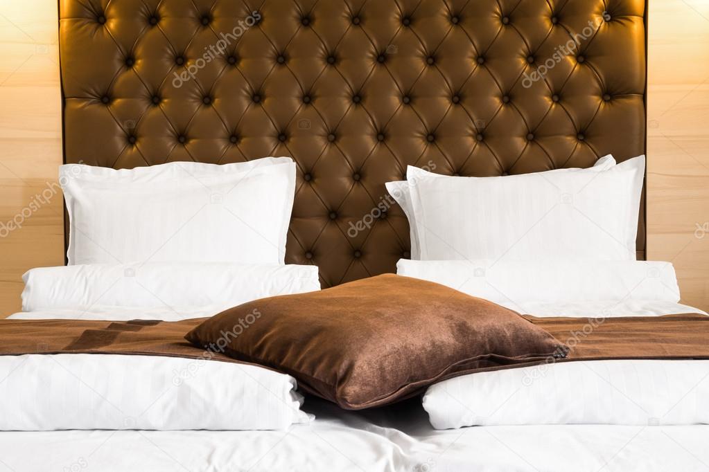 Luxury queen-size bed with upholstered headboard