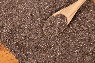 Chia seeds with wooden spoon clipart