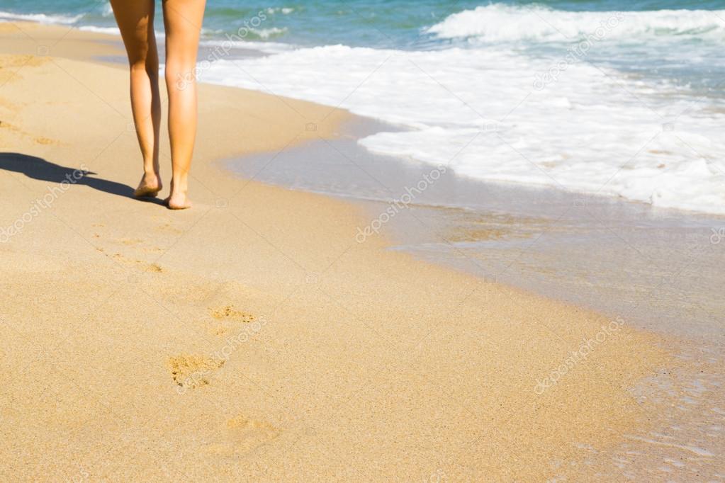 Woman walking on the beach