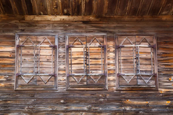 Old wooden windows with closed shutters — Stock Photo, Image