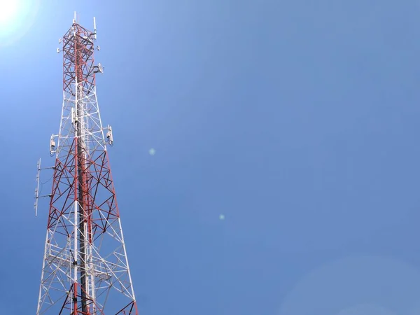 Telephone towers used to broadcast signals at dusk.