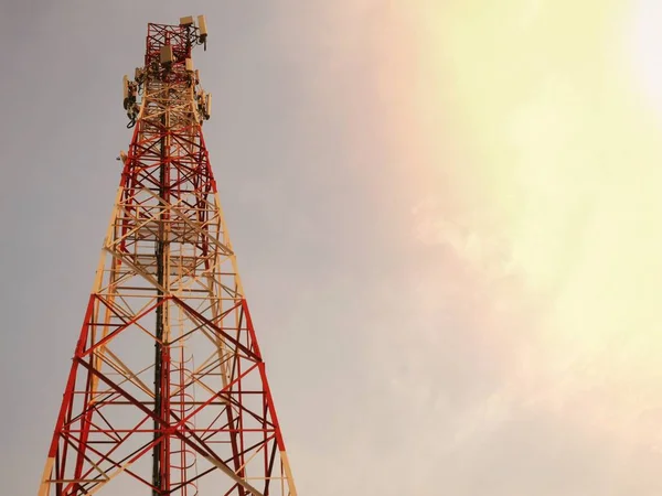 Telephone towers used to broadcast signals at dusk.