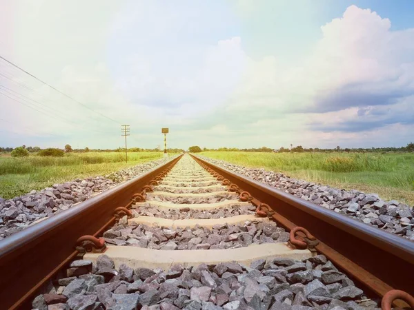 An old railroad, the route of travel when the sun goes down and sees nature and the sky.