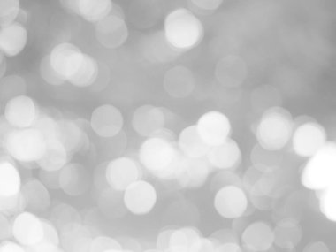 Parlayan beyaz bokeh resmi bir arkaplan illüstrasyonu olarak kullanılabilir veya bir reklama metin eklemek için.