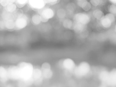 Parlayan beyaz bokeh resmi bir arkaplan illüstrasyonu olarak kullanılabilir veya bir reklama metin eklemek için.