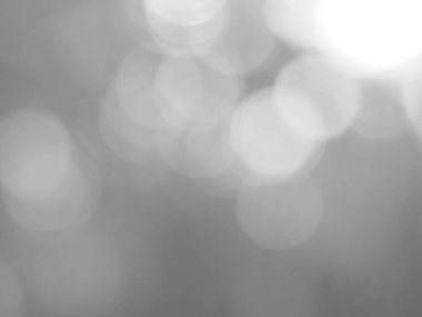 Parlayan beyaz bokeh resmi bir arkaplan illüstrasyonu olarak kullanılabilir veya bir reklama metin eklemek için.