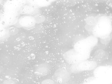 Aydınlatılmış beyaz bokeh resmi arkaplan illüstrasyonu olarak kullanılabilir veya metin eklenebilir.