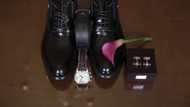 MOSCOW - JULY 12, 2020: Man's shoes, belt, watch and cufflinks — Stock Video
