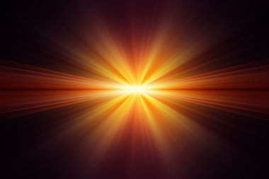 Explosion of yellow light on black background