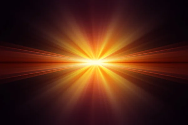 Explosion of yellow light on black background — 图库照片