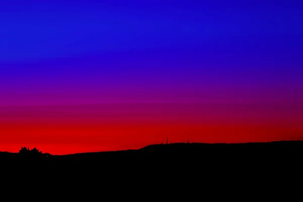 Pôr do sol vermelho e azul — Fotografia de Stock