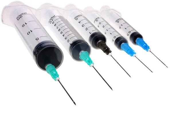 Four new empty medical plastic disposable syringes  isolated on white with Clipping Path — Stock Photo, Image