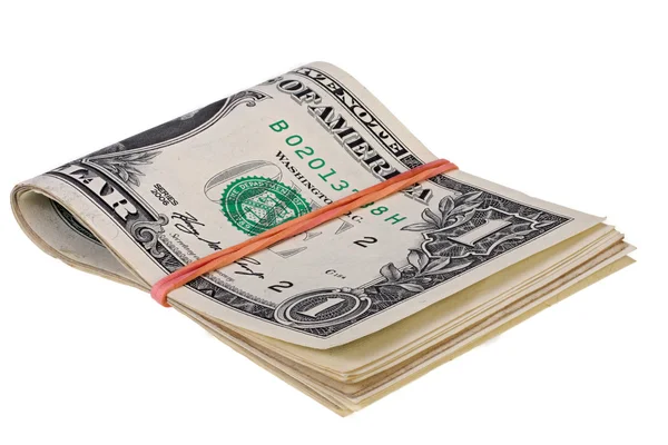 Beyaz bir arka plan üzerinde bir elastik bant tarafından tutturulmuş dolar sürüsü