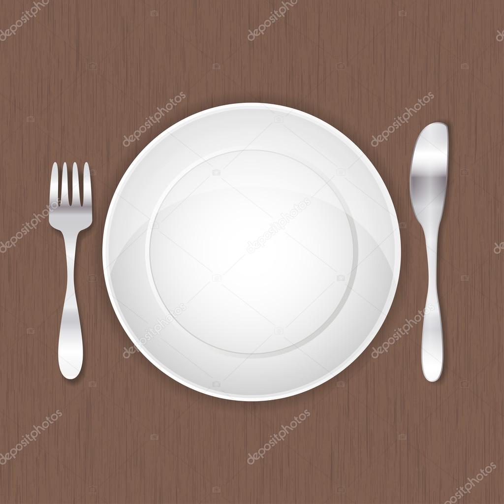 Empty white plate, fork and knife