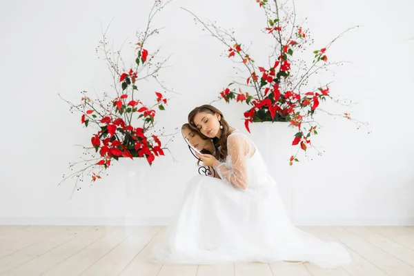 Fashion portrait of young woman. Bride posing in white wedding dress. Wedding trends and concept. Indoor bride morning.