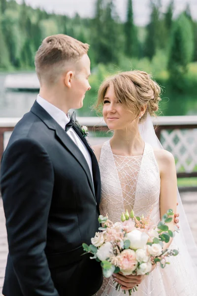 Portrait Handsome Man Stylish Suit Embracing His Charming Young Bride — Stock Photo, Image