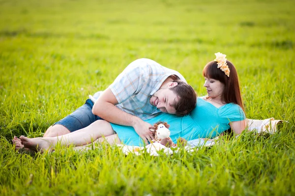 Young family on nature — Stock Photo, Image