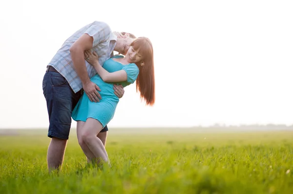 Young family on nature — Stock Photo, Image