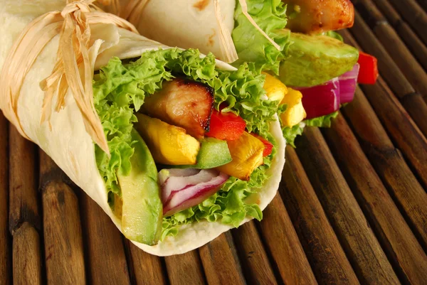 Chicken wrap sandwiches on mat — Stock Photo, Image