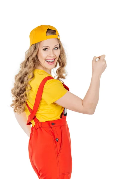 Woman Wearing Yellow Uniform Drawing White Wall Smiling Back View Royalty Free Stock Photos