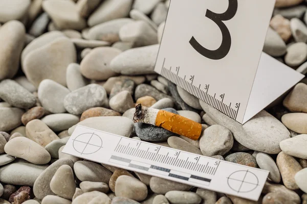 Crime scene investigation - cigarette butt. — Stock Photo, Image