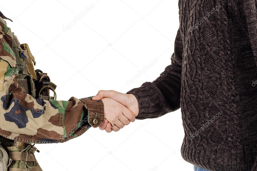 Soldier shaking hands with civil man